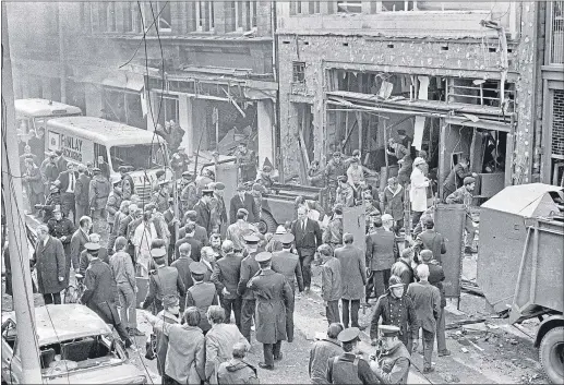  ??  ?? Emergency crews help survivors in the rubble after the no-warning car bomb in Lower Donegall Street in Belfast in March, 1972Pictur­e:Victor Patterson