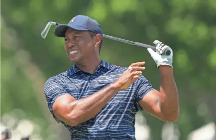  ?? MICHAEL MADRID/USA TODAY SPORTS ?? Tiger Woods plays the ninth hole during the first round of the PGA. He shot 74.