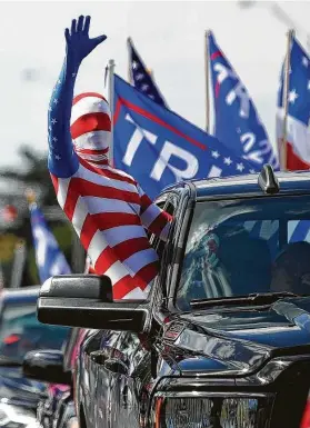  ?? Rebecca Blackwell / Associated Press ?? Left: Joe Biden, the Democratic presidenti­al nominee, visits his childhood home in Scranton, Pa. Right: Supporters of President Donald Trump gather in Miami.