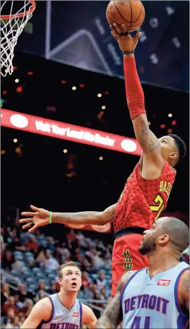  ?? Todd Kirkland / AP ?? Atlanta guard Kent Bazemore (24) goes up for the shot against Detroit on Sunday.