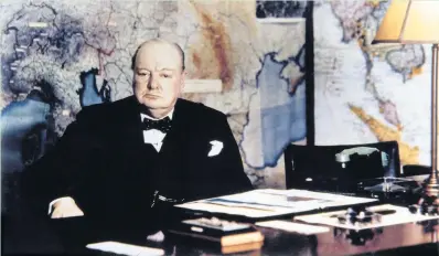  ??  ?? Winston Churchill at his desk in the No 10 Annexe Map Room, May 1945, in the Cabinet war rooms