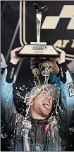  ?? (AP/Colin E. Braley) ?? Tyler Reddick celebrates after winning the NASCAR Cup Series race at Kansas Speedway in Kansas City, Kan., on Sept. 10. A victory in any of the next three races would put Reddick in the final eight of the playoffs.