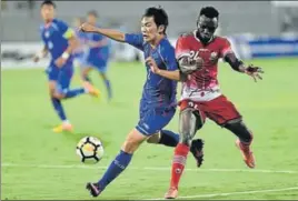  ?? PTI ?? Kenya player Vincent Wasambo (in red) and Chinese Taipei player Chienming Wang (in blue) vie for the ball during the Hero Interconti­nental football Cup in Mumbai on Friday.