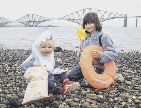  ??  ?? 0 Suzy Ensom and Winnie Maia try out their costumes for Jaws ahead of Film Fest on the Forth at Port Edgar Marina later this month