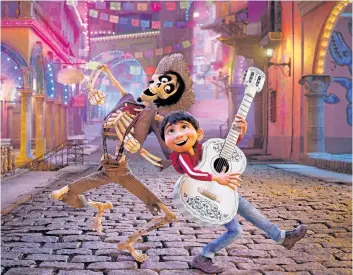  ?? DISNEY- PIXAR/ THE ASSOCIATED PRESS ?? Hector, voiced by Gael Garcia Bernal, left, and Miguel, voiced by Anthony Gonzalez, appear in a scene from the animated film, Coco.