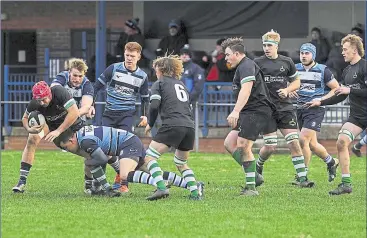  ?? ?? Two Newbury Blues players make a tackle to break down a Buckingham attack
Ref:48-1421C