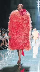  ?? [AP FILE PHOTO] ?? A model wears a coral outfit from the Marc Jacobs spring 2019 collection in September during Fashion Week in New York. Pantone Color Institute has chosen the color Living Coral as its 2019 color of the year.