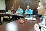  ?? Staff photo by Junius Stone ?? ■ Holly Danner, right, Kelly Butler and John Aldredge of Kinetic by Windstream discuss cybersecur­ity during the Lunch and Learn event Wednesday at the Chamber of Commerce.