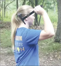  ?? Submitted Photo ?? Mary P. Cantrell, throws a hatchet during the Noark Girl Scout Camp 2021. The camp is just one way cookie sales help fund Girl Scout activities for Troop 3255.