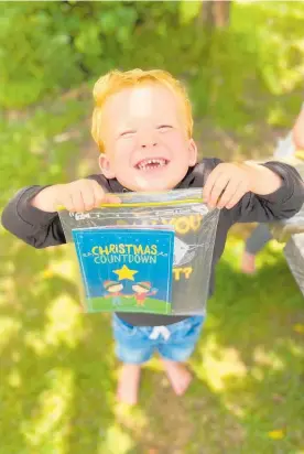  ?? ?? Three-year-old Jed Chalmers finding a book at Marine Gardens in Raumati Beach.