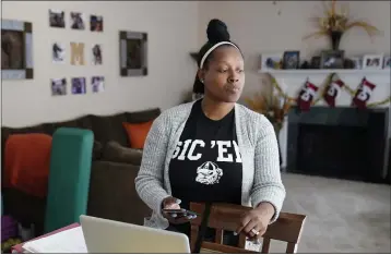  ?? PHOTOS BY JOHN BAZEMORE — THE ASSOCIATED PRESS ?? Shanita Matthews pauses as she speaks in her home in Suwanee, Ga., on Wednesday. Matthews had to close her wedding business because of the coronaviru­s outbreak.