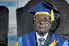  ?? BEN CURTIS/ THE ASSOCIATED PRESS ?? Zimbabwe’s President Robert Mugabe presides over a graduation ceremony at Zimbabwe Open University on the outskirts of Harare, Zimbabwe, on Friday.