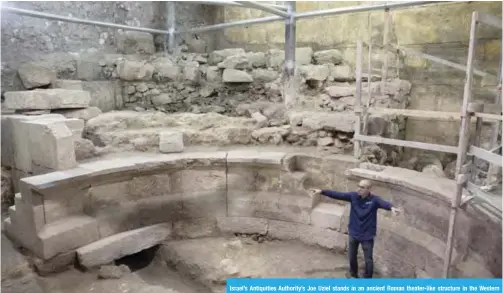  ??  ?? Israel’s Antiquitie­s Authority’s Joe Uziel stands in an ancient Roman theater-like structure in the Western Wall tunnels in Jerusalem’s old city. — AP