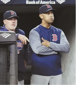  ?? AP PHOTO ?? TENSE MOMENT: Pitching coach Dana LeVangie, left, and Alex Cora react after the Yankees take the lead during a game in the Bronx.