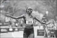  ?? JASON DECROW/AP PHOTO ?? Sharon Lokedi of Kenya crosses the finish line first in the women’s division of the 2022 New York City Marathon. She’s back to defend her title Sunday.