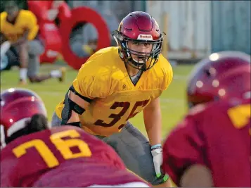  ?? Buy these photos at YumaSun.com PHOTOS BY RANDY HOEFT/YUMA SUN ?? ARIZONA WESTERN FRESHMAN LINEBACKER Xander Carmichael peers into the backfield during Tuesday night’s practice at AWC.