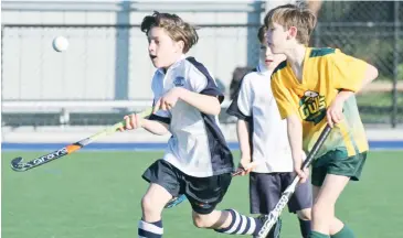  ??  ?? Warriors player Thomas Pettigrew was penalised for lifting the ball on this occasion during the under 12 match against the Gulls.