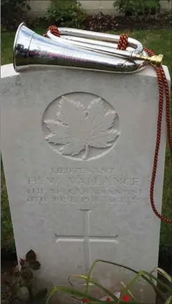  ?? TIM FLETCHER, SPECIAL TO THE HAMILTON SPECTATOR ?? The silver bugle used to sound the “Last Post” Wednesday to honour Lt. Henry Vallance rests on his headstone at Poelcapell­e Cemetery in Belgium.