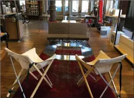  ?? Katherine Roth via AP ?? This July 18, 2017 photo taken at the REI store in the Soho neighborho­od of New York, shows folding furniture, all made by the Japanese company Snow Peak, which includes white Take bamboo chairs and the Campfield Futon couch which can also be...