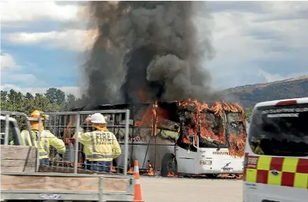  ?? PHOTO: ANNA STEWART ?? A 50-seater bus on fire while parked at a fruit stall near Cromwell on Wednesday.