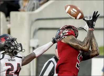  ?? Arkansas Democrat-Gazette/MITCHELL PE MASILUN ?? Arkansas State wide receiver Kendrick Edwards (right) catches a 36-yard touchdown pass from Justice Hansen during Saturday’s 48-21 victory over Southeast Missouri State. This week, the Red Wolves face top-ranked Alabama.