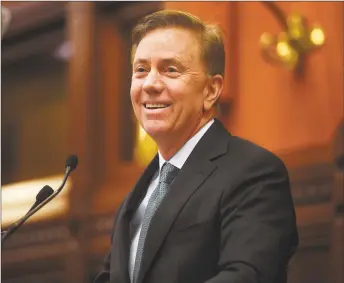  ?? Brian A. Pounds / Hearst Connecticu­t Media ?? Gov. Ned Lamont delivers his budget address to the General Assembly at the Capitol in Hartford on Wednesday. Below, House Minority Leader Themis Klarides, R- Derby, and Senate Minority Leader Len Fasano, R- North Haven, chat before the address.