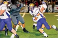  ?? Special to the Democrat-Gazette/MARK STALLINGS ?? Booneville’s Matt Berry (right) tries to avoid Charleston defensive lineman Cody Pogue during their game Oct. 31. Charleston won 47-20, but the teams meet again in the Class 3 semifinals Friday.