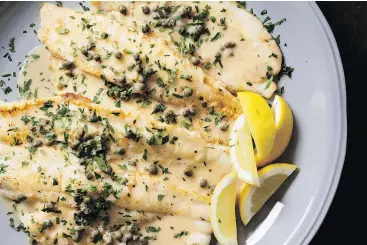  ?? CARL TREMBLAY/AMERICA’S TEST KITCHEN/THE ASSOCIATED PRESS ?? Pan-fried sole is even more delicious with a lemon-caper pan sauce.