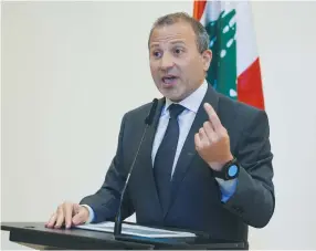  ?? (Issam Abdallah/Reuters) ?? GEBRAN BASSIL, leader of Lebanon’s biggest Christian bloc, the Free Patriotic Movement, speaks after a parliament­ary session in Beirut, in October.