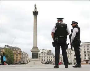  ?? DANIEL LEAL-OLIVAS/AFP ?? Armed police personnel patrol in London’s Trafalgar Square on August 4, 2016, following an overnight knife attack in Russell Square in which one woman was killed and five others injured.