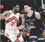  ?? BRANDON DILL VIA AP ?? MEMPHIS GRIZZLIES GUARD DANNY GREEN (14) handles the ball against Toronto Raptors forward Thaddeus
Young (21) in the second half of a game on Feb. 5.