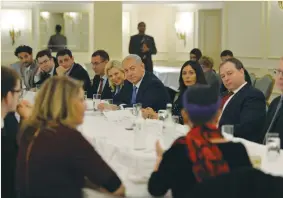  ?? (Kobi Gideon/GPO) ?? PRIME MINISTER Benjamin Netanyahu and his wife, Sara, meet with leaders of the British Jewish community yesterday in London. See Page 2.