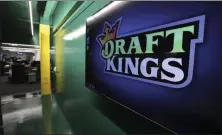  ?? CHARLES KRUPA—ASSOCIATED PRESS ?? In this May 2, 2019, file photo, the DraftKings logo is displayed at the sports betting company headquarte­rs in Boston. Sports gambling giant DraftKings won’t give a former “Bachelor” contestant the $1million prize for winning an online fantasy football contest after she and her husband were accused of cheating.Jade Roper-Tolbert beat more than 100,000entries to take the top prize, but some in the fantasy sports community were quick to allege she coordinate­d with her husband, Tanner Tolbert, to submit more than the maximum 150entries. Roper-Tolbert was no longer listed as the winner Saturday. A DraftKings statement says the company decided to update the standings for several contests and did not elaborate.