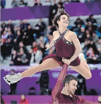  ?? PAUL CHIASSON THE CANADIAN PRESS ?? Meagan Duhamel and Eric Radford not only won a bronze medal, they made news by rescuing a pup from South Korea’s dog meat trade and planned to whisk home another one.