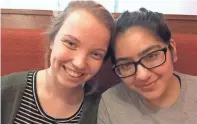  ?? ANNYSA JOHNSON / MILWAUKEE JOURNAL SENTINEL ?? Julia Craig and Ravina Sachdev have been friends since elementary school. The 17-year-olds find themselves on opposite ends of the gun control debate.