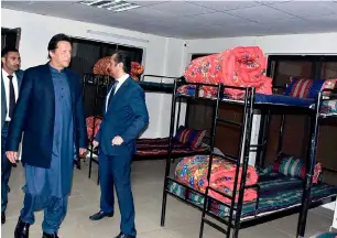  ?? APP ?? Prime Minister Imran Khan inspecting bedrooms of the shelter home after inaugurati­ng it in Islamabad. —