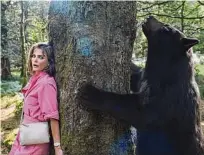  ?? Universal Studios ?? Keri Russell stars opposite a CGI bear in “Cocaine Bear,” directed by Elizabeth Banks.