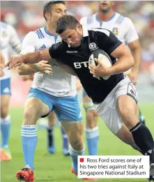  ??  ?? Ross Ford scores one of his two tries against Italy at Singapore National Stadium