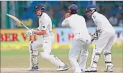  ?? AP ?? New Zealand’s Mitchell Santner (left) in action on the fifth day of the Test against India at Green Park Stadium in Kanpur on Monday.