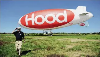  ?? Autumn Driscoll/Connecticu­t Post ?? Pilot Leigh W. Bradbury walks away from the Hood Blimp after a short flight over Bridgeport, Conn. Friday, August 31, 2012.