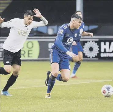  ??  ?? CATCH ME IF YOU CAN: Macdonald runs away from a Torquay defender during a Shay game this season.