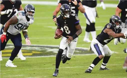  ?? AP ?? Quarterbac­k Lamar Jackson, who will not play against the Steelers on Tuesday night, is among at least 12 Ravens players who have tested positive for COVID-19.
