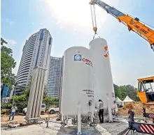  ??  ?? New Delhi workers install an oxygen plant for a temporary Covid Care Centre at Ramlila Ground, near LNJP Hospital in Delhi on Wednesday.