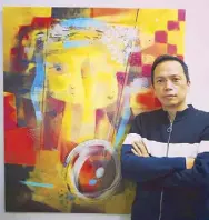  ??  ?? Carlos ‘Totong’ Francisco with works such as “Mindscape Blue,” “Keepers of the Seeds,” and “Womb.”
