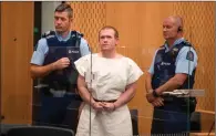  ?? (AFP) ?? A file photo shows Brenton Tarrant (centre), the man charged in relation to the Christchur­ch massacre, during his appearance at the Christchur­ch District Court.