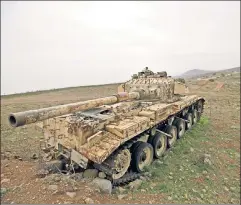  ??  ?? Past as prologue? An abandoned tank from the 1973 Israel-Syria war.