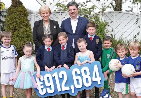  ??  ?? Minister Heather Humphreys and Intel Ireland General Manager Eamonn Sinnott are pictured with some of the children who will benefit at the Intel Matching Grant celebratio­n