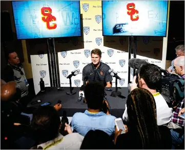  ?? AP PHOTO BY MARK J. TERRILL ?? Southern California quarterbac­k Sam Darnold speaks at Pac-12 NCAA college football Media Day, Thursday, in the Hollywood section of Los Angeles.