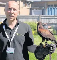  ??  ?? n SHOO: Andy Dobbs with Bomber the Harris hawk – Andy’s birds visit Hillingdon Hospital once a week to discourage pigeons from nesting in the building