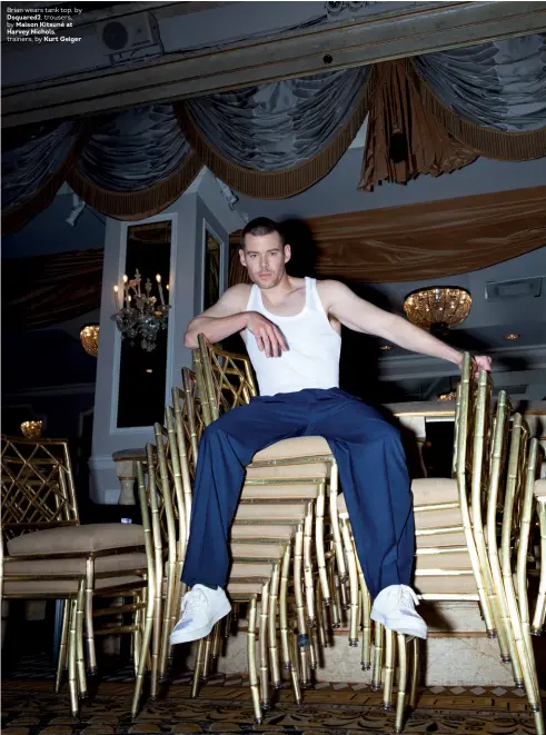  ??  ?? Brian wears tank top, by Dsquared2, trousers, by Maison Kitsuné at Harvey Nichols, trainers, by Kurt Geiger
DECEMBER 2019
